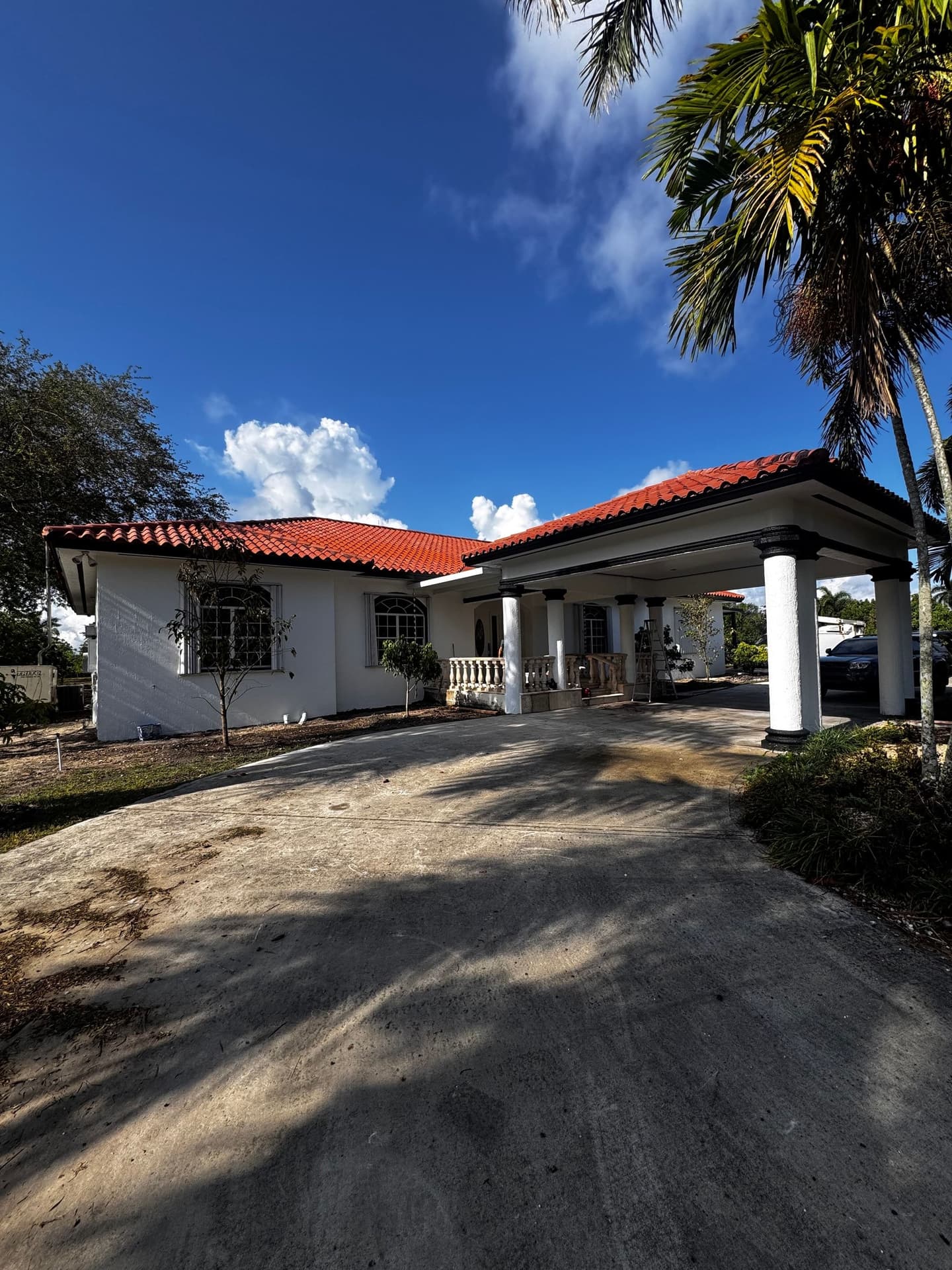 Freshly finished stucco home with a new tile roof by Cristian House Remodeling LLC