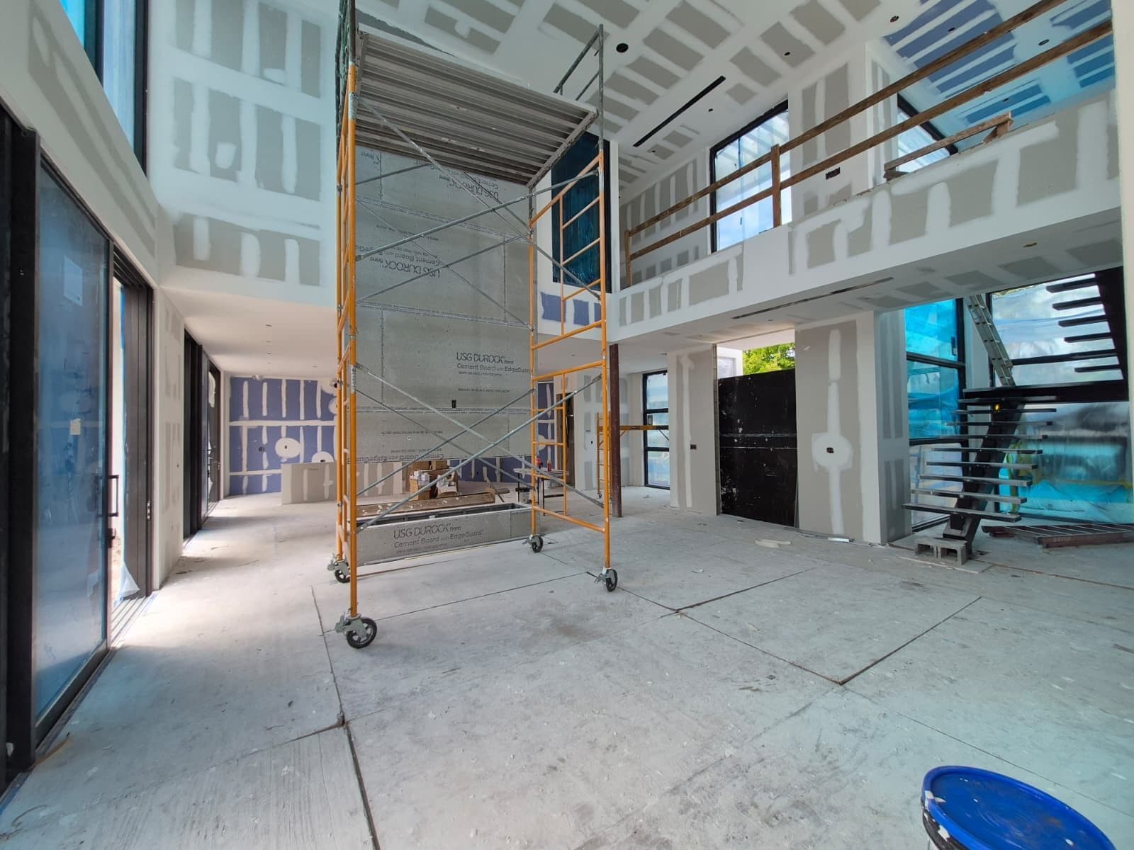 Drywall and cement board going up on a Cristian House Remodeling LLC project
